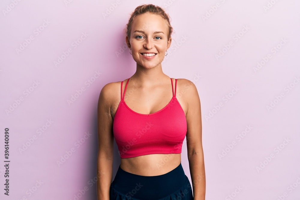 Beautiful caucasian woman wearing sportswear with a happy and cool smile on face. lucky person. Beautiful caucasian woman wearing sportswear with a happy and cool smile on face. lucky person.