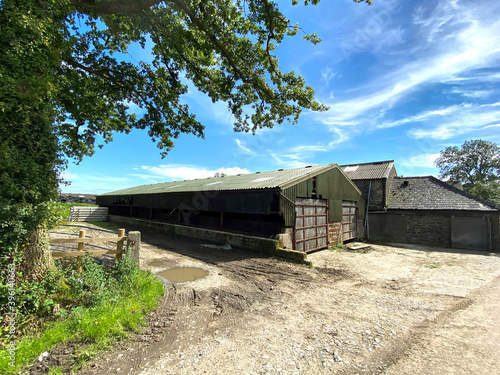 Farm buildings, on Hellifield Road, on a sunny day in, Bolton by Bowland, Clitheroe, UK photo