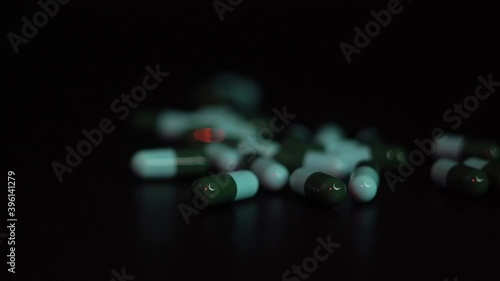 green pills in dark tone
