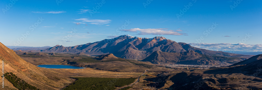 Fototapeta premium Panoramic of Esquel city surrounded by mountains and lakes during spring season, Patagonia, Argentina