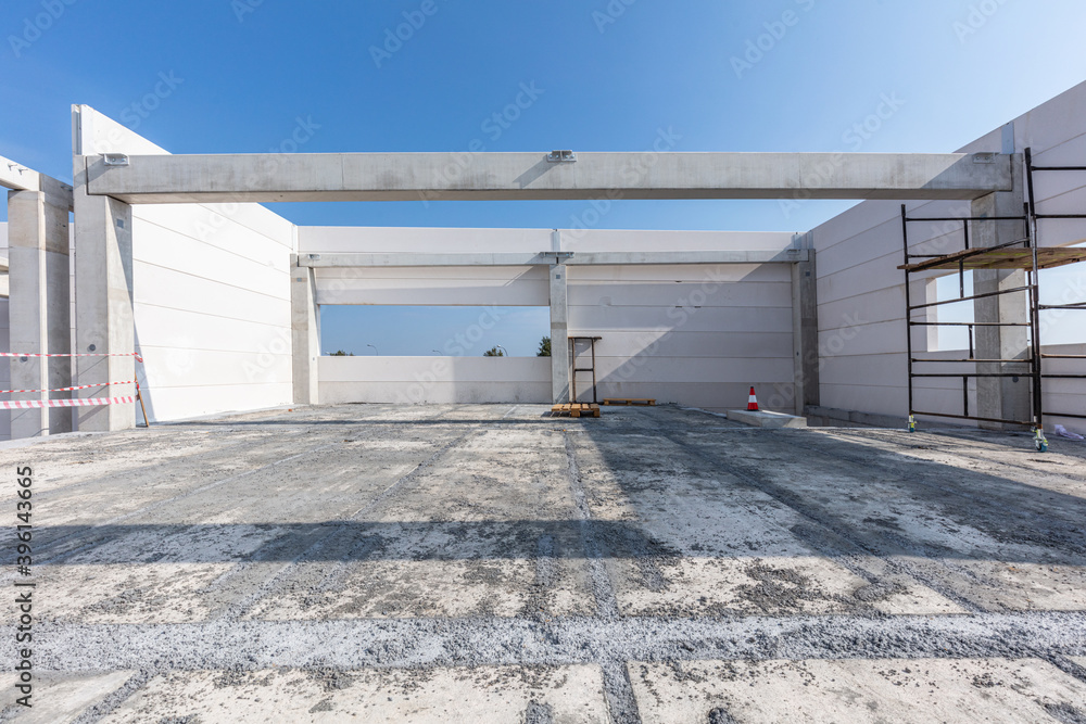 Warehouse construction site. Building a new industrial hall Warehouse construction site. Building a new industrial hall