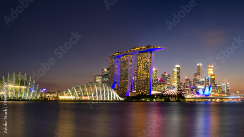 Panorama view of cityscape business downtown building area during twilight time at Singapore.