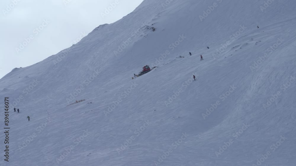 WS Pistenbully driving up mountain WS Pistenbully driving up mountain
