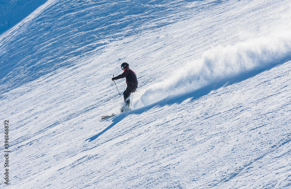 Snowboarder on the slopes of the Ski resort GrandVallira. Pyrenees mountains. Andorra.