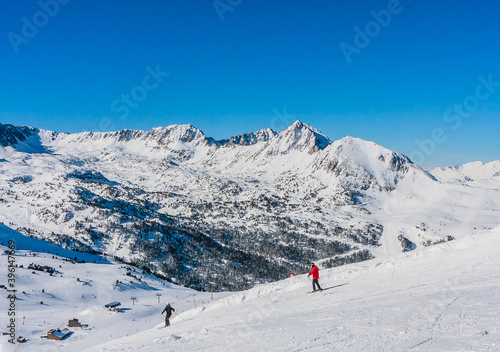 Ski resort GrandVallira. Views of the Pyrenees mountains. Ski cabins with skiers. Rest with the whole family and friends. Andorra © Nikolai Korzhov