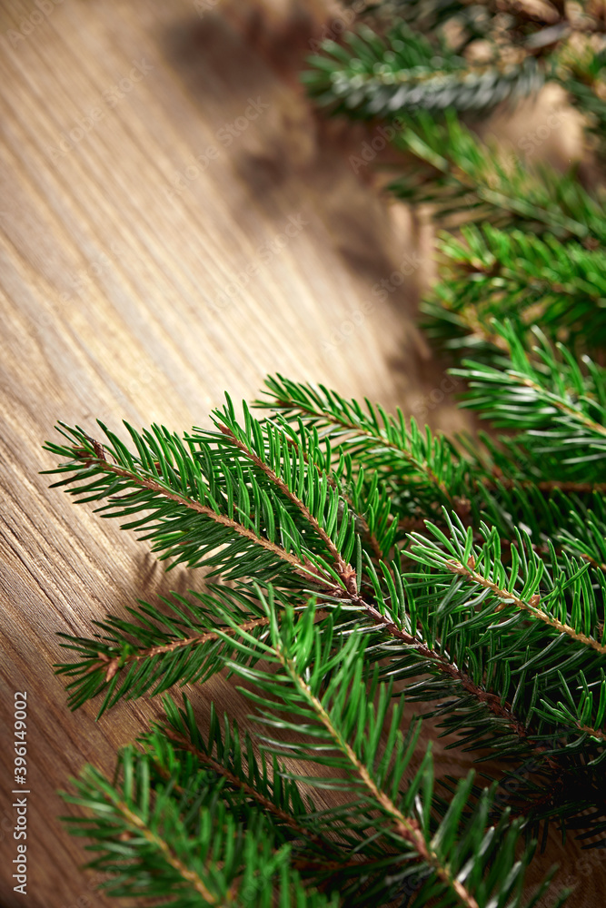 fir branches on the wooden background fir branches on the wooden background