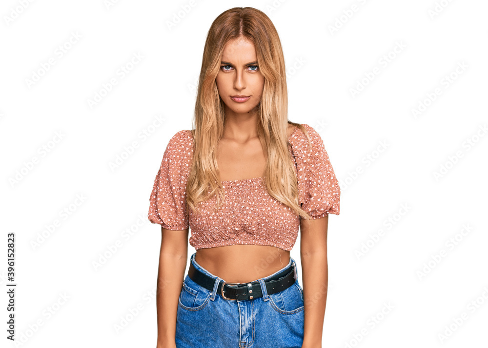 Beautiful blonde young woman wearing summer top skeptic and nervous, frowning upset because of problem. negative person. Beautiful blonde young woman wearing summer top skeptic and nervous, frowning upset because of problem. negative person.