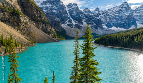 Fototapeta Naklejka Na Ścianę i Meble -  Moraine lake beautiful landscape in summer sunny day morning. Sparkle turquoise blue water, snow-covered Valley of the Ten Peaks. Banff National Park, Canadian Rockies, Alberta, Canada