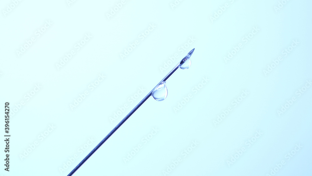 Vaccine dripping from sterile needle syringe. Concept of medical research development and production of vaccine against coronavirus, COVID 19. Drugs and medications for pharmaceutical industry. Vaccine dripping from sterile needle syringe. Concept of medical research development and production of vaccine against coronavirus, COVID 19. Drugs and medications for pharmaceutical industry.
