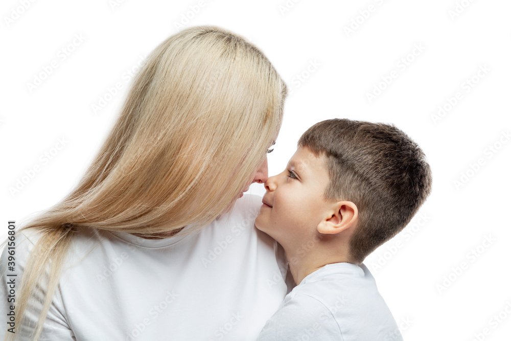 Mom and son hug tenderly. Love, understanding and tenderness. Close-up. Isolated on white background. Mom and son hug tenderly. Love, understanding and tenderness. Close-up. Isolated on white background.