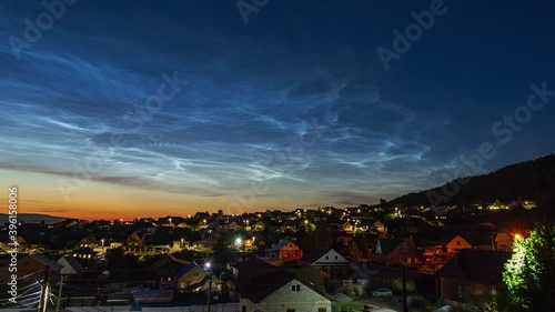 noctilucent silver clouds in the sky above the village 4k time lapse video photo