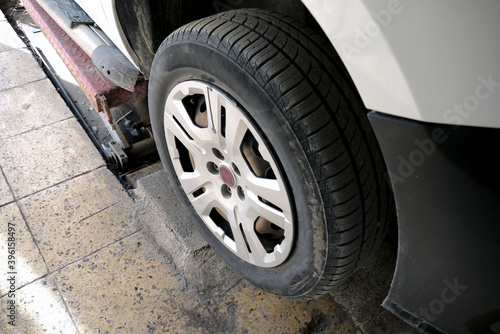 fitting winter tires on a car, tire mechanic, © kodbanker