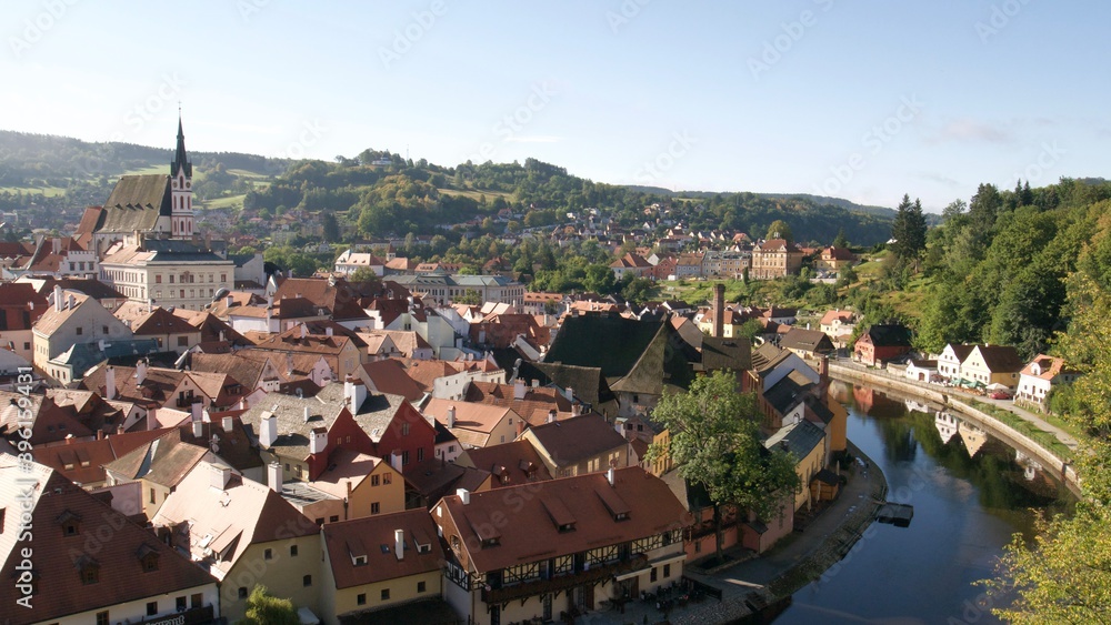 Famous old Czech town with red roofs and a castle on a summer day 