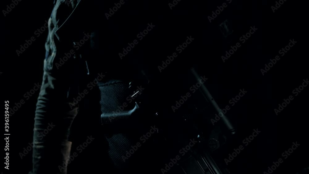Man in a multicam on a black background holds an AK in his hands Man in a multicam on a black background holds an AK in his hands