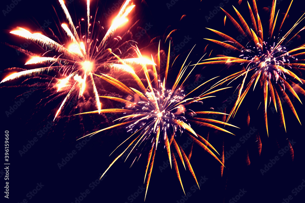 Fototapeta premium Fireworks in the night winter sky. New year celebration.