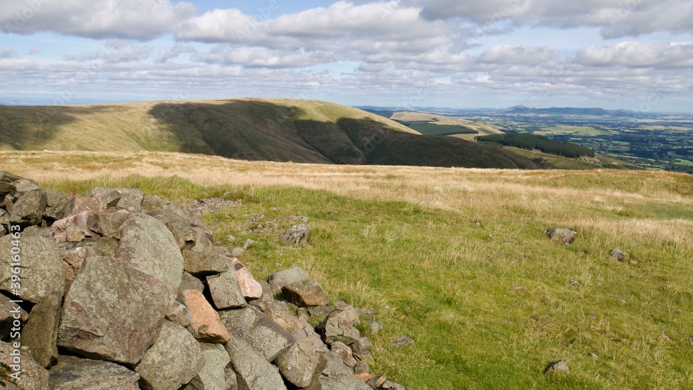 view over the Ochill Hills on a warm summer day with stones on the top view over the Ochill Hills on a warm summer day with stones on the top