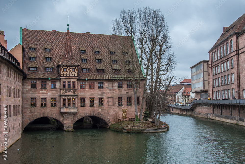 View from the museum bridge to the river Pegnitz and Heilig Geist Spital in Nuremberg.