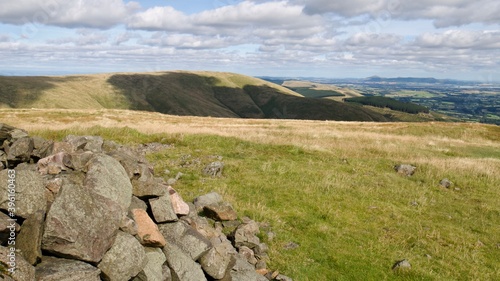 view over the Ochill Hills on a warm summer day with stones on the top