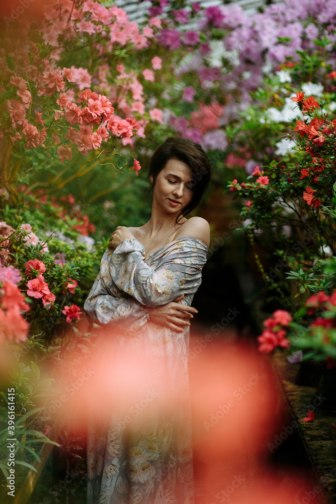 dreamy girl in a big flower garden dreamy girl in a big flower garden