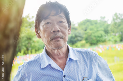Asian old man in the outdoors, Portrait old man concept