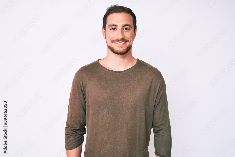 Young handsome man wearing casual clothes with a happy and cool smile on face. lucky person. Young handsome man wearing casual clothes with a happy and cool smile on face. lucky person.