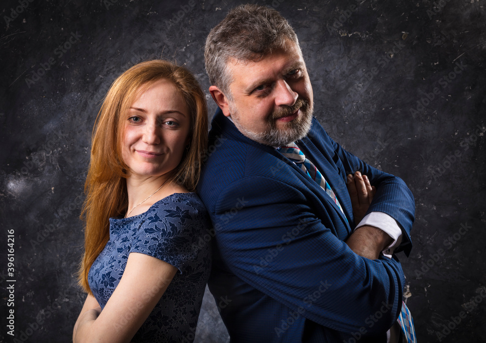 Bearded man and young woman, happy couple studio portrait Bearded man and young woman, happy couple studio portrait