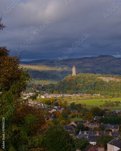 View of the Ochill Hills and the Wallace Monument over Forth Valley and Stirling on a cloudy autumn day photo