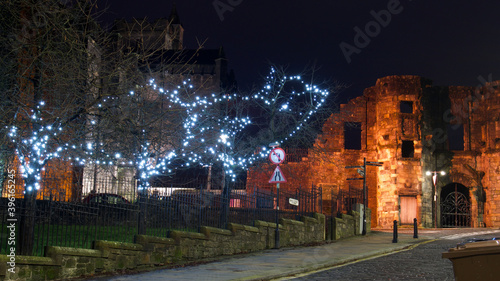 magical evening photo of Mar's Wark and trees with fairy lights in Stirling