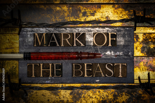 Mark Of The Beast text with syringe on textured grunge copper and vintage gold background