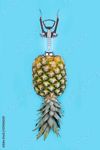 Pineapple with corkscrew,fresh juice creative concept