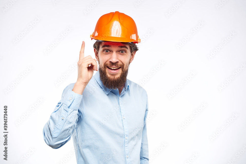 Engineers shirt orange hard hat construction lifestyle emotions cropped view light background Engineers shirt orange hard hat construction lifestyle emotions cropped view light background