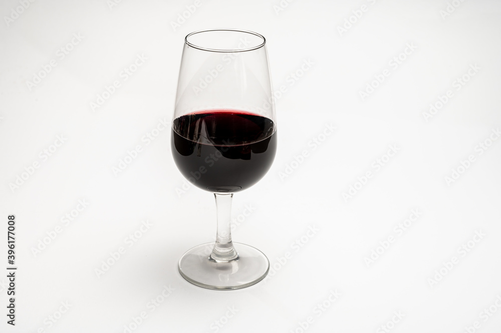Glass of vintage ruby port wine isolated on white background