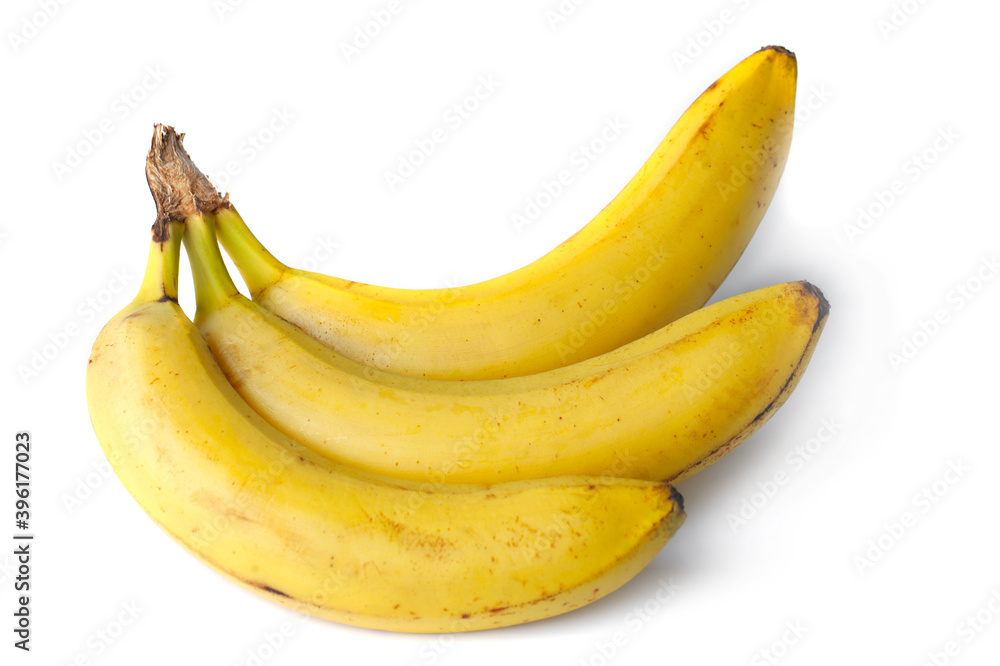 Three yellow bananas close up on a white background Three yellow bananas close up on a white background