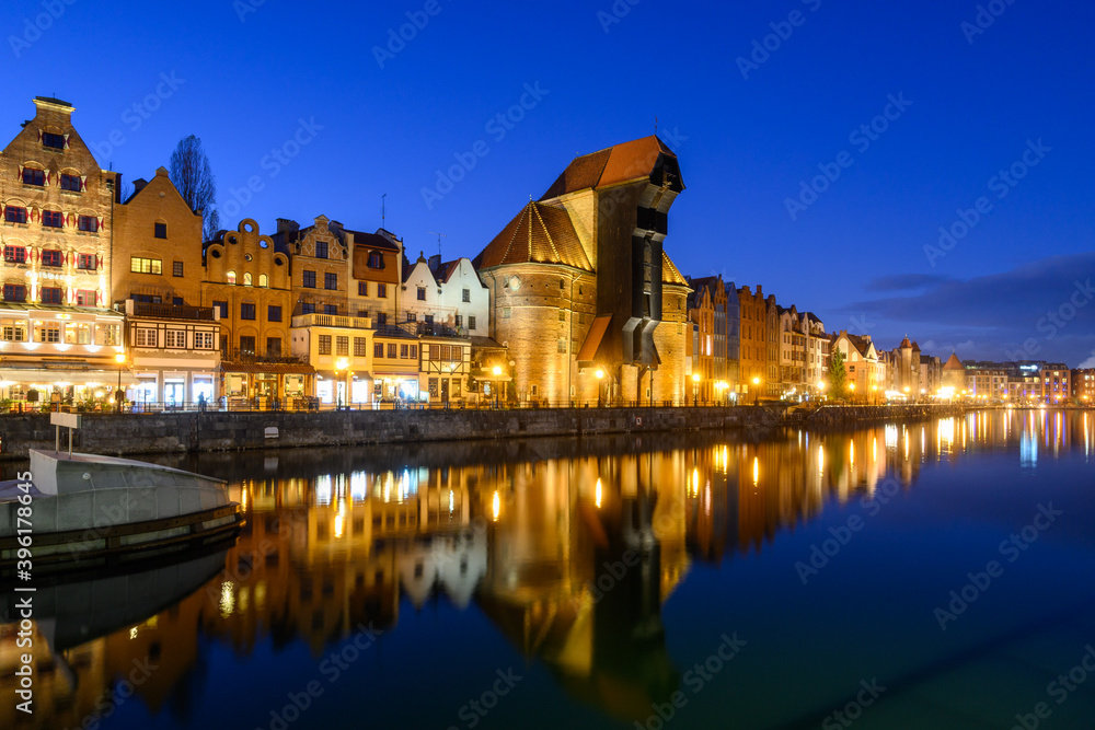 Famous old port crane of Gdansk and Motlawa River at night. Poland, Europe.