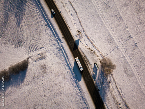 Aerial view on road and forest landscape in winter season.