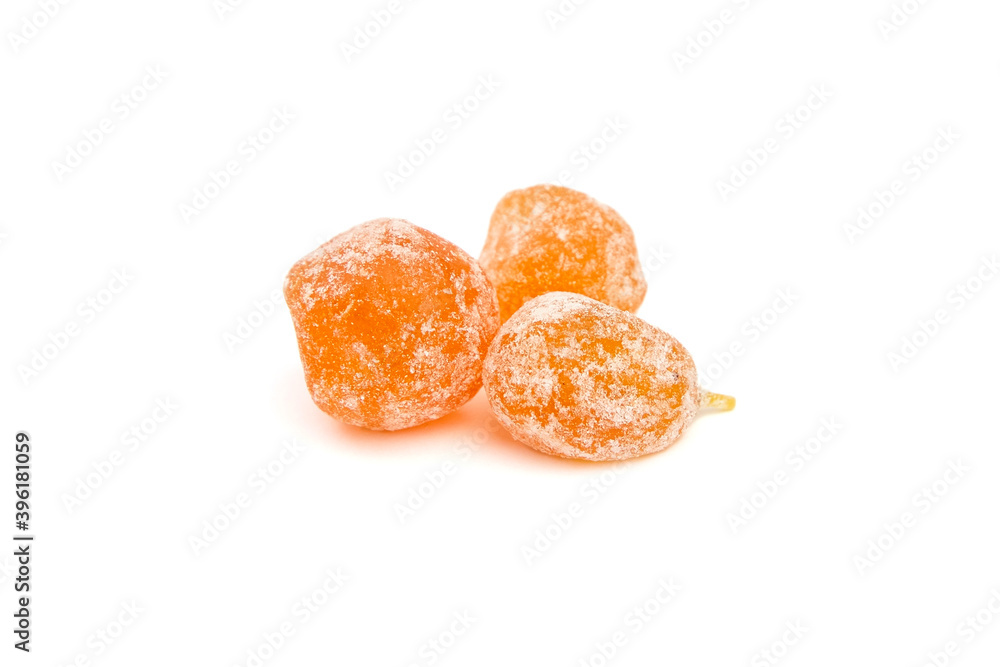 Dried fruits, three candied kumquats isolated on white background Dried fruits, three candied kumquats isolated on white background