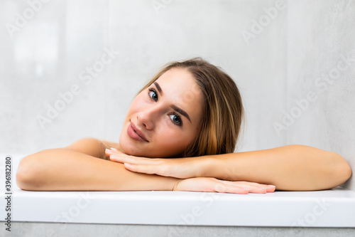 Young attractive sexy woman relaxing in bathtube