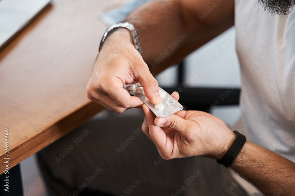 Man taking medical pills