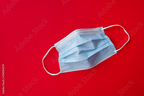 blue medical mask on red background