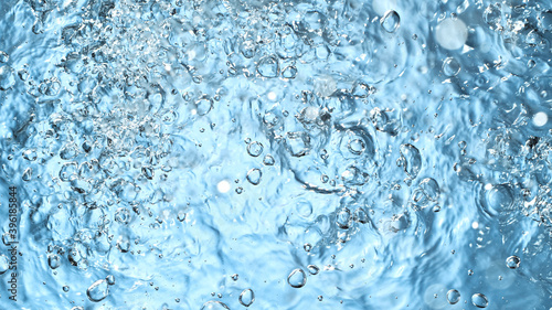 Water splash isolated on blue background, freeze motion