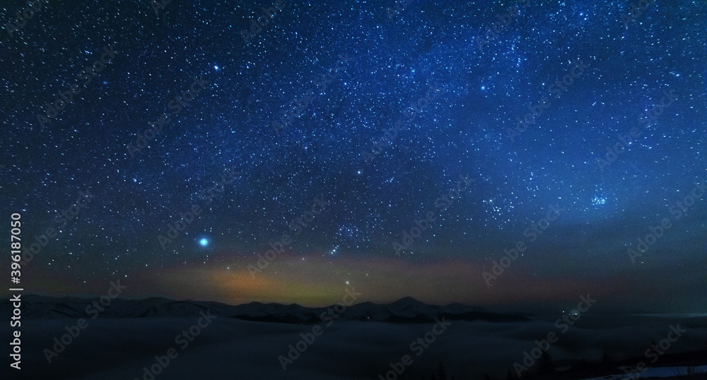 Space starry nights with a bright Milky Way on the backdrop of tourists with tents. Space starry nights with a bright Milky Way on the backdrop of tourists with tents.