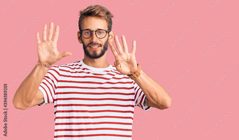 Handsome blond man with beard wearing casual clothes and glasses showing and pointing up with fingers number nine while smiling confident and happy. Handsome blond man with beard wearing casual clothes and glasses showing and pointing up with fingers number nine while smiling confident and happy.