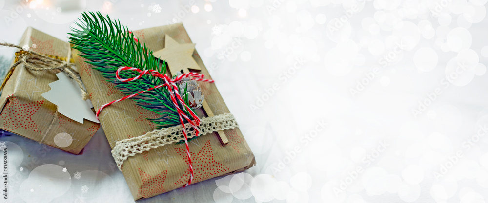 Gift box packed in paper and tied with twine, christmas zero waste, eco-friendly DIY gift wrapping