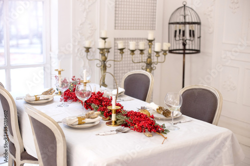 Festive Christmas and New Year table setting in natural and white colors