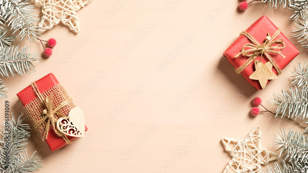 Christmas frame. Xmas tree branches decorated red berries, stars and vintage gifts on beige background. Christmas banner mockup, New Year postcard template. Christmas frame. Xmas tree branches decorated red berries, stars and vintage gifts on beige background. Christmas banner mockup, New Year postcard template.