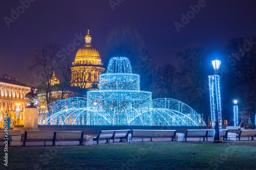 Christmas evening in Saint-Petersburg. Christmas in the Russian Federation. New year in Russia. Fountain of luminous garlands at St. Isaac Cathedral. New Year's Petersburg. City christmas decorations