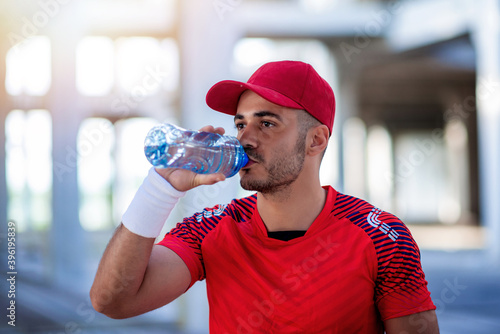 Athletic man with water bottle