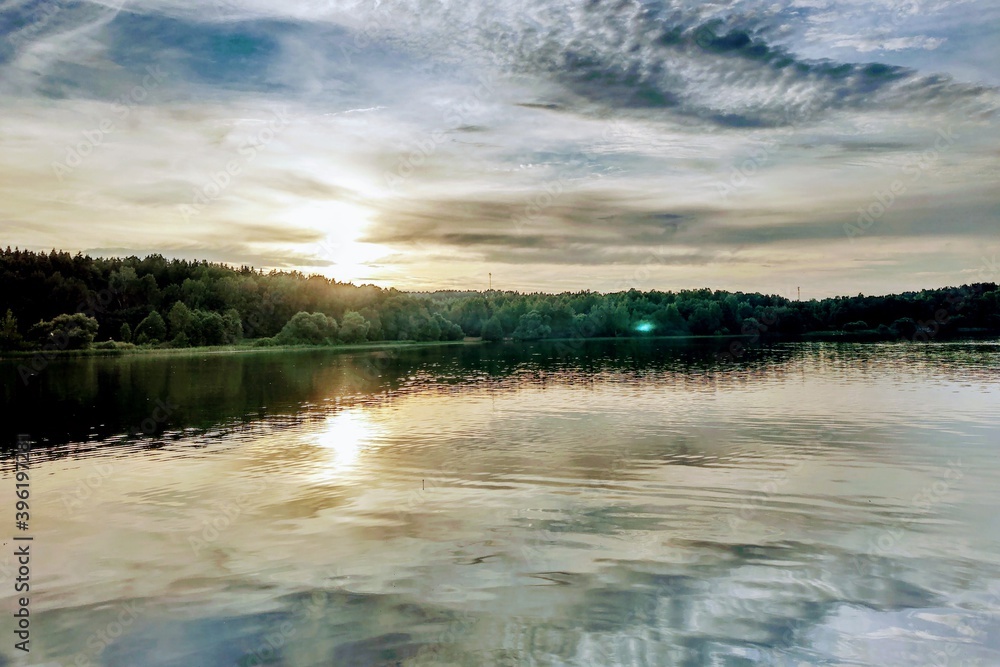 Beautiful sunset on the lake or river. Nature background. Beautiful sunset on the lake or river. Nature background.