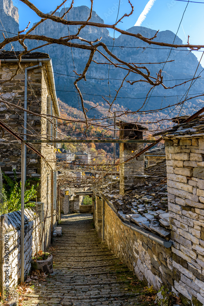 Traditional architecture during fall season in the picturesque village of Mikro papigo in Epirus zagori greece Traditional architecture during fall season in the picturesque village of Mikro papigo in Epirus zagori greece