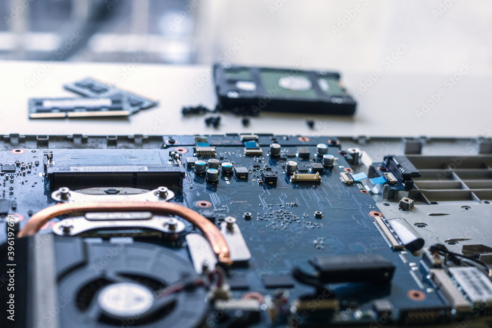 Laptop disassembling parts and devices on white background, laptop repair Laptop disassembling parts and devices on white background, laptop repair